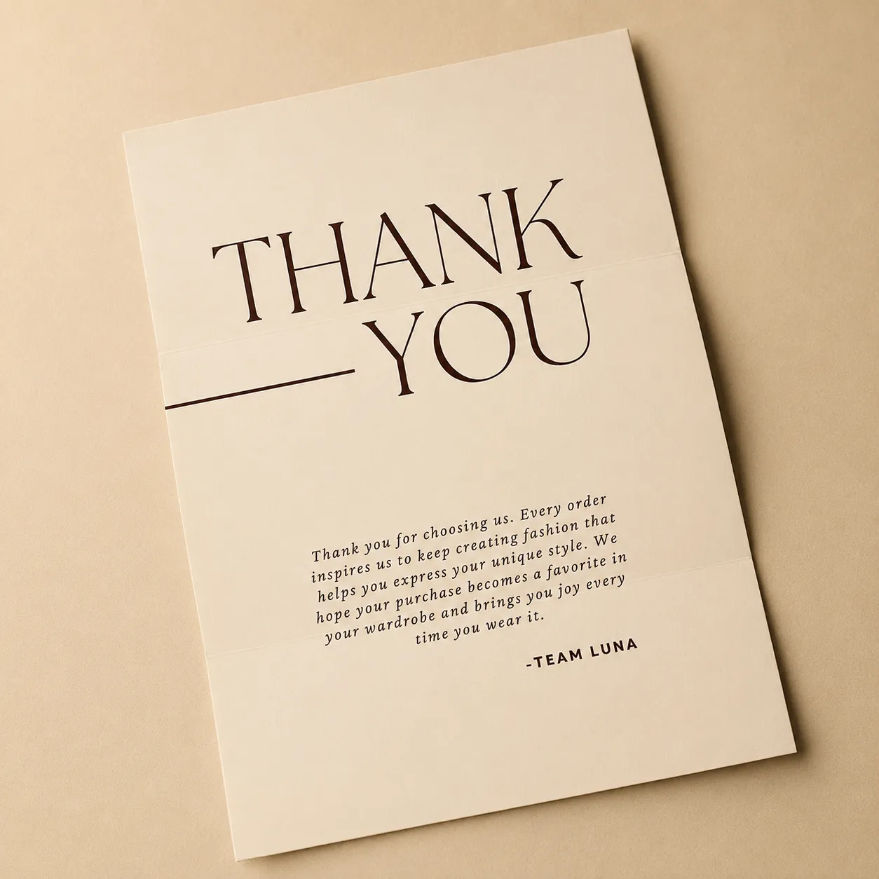 Branded thank-you card and envelope for a fashion label